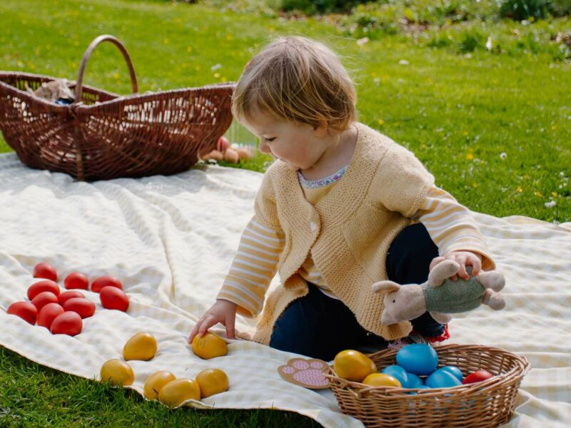 A toddle counts up Easter eggs that have been collected at the Powderham Castle Easter Egg Hunt
